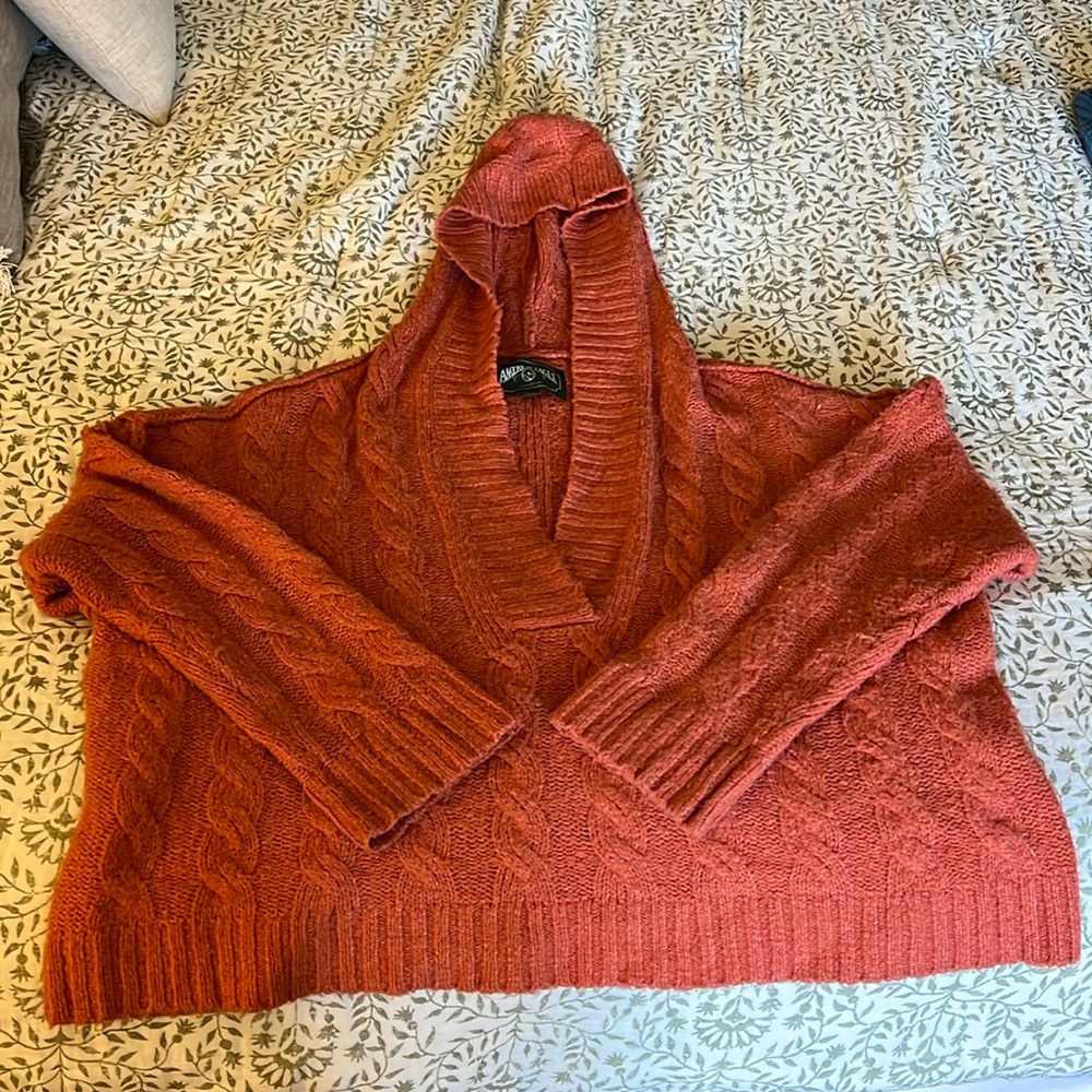 American Eagle soft orange sweater.